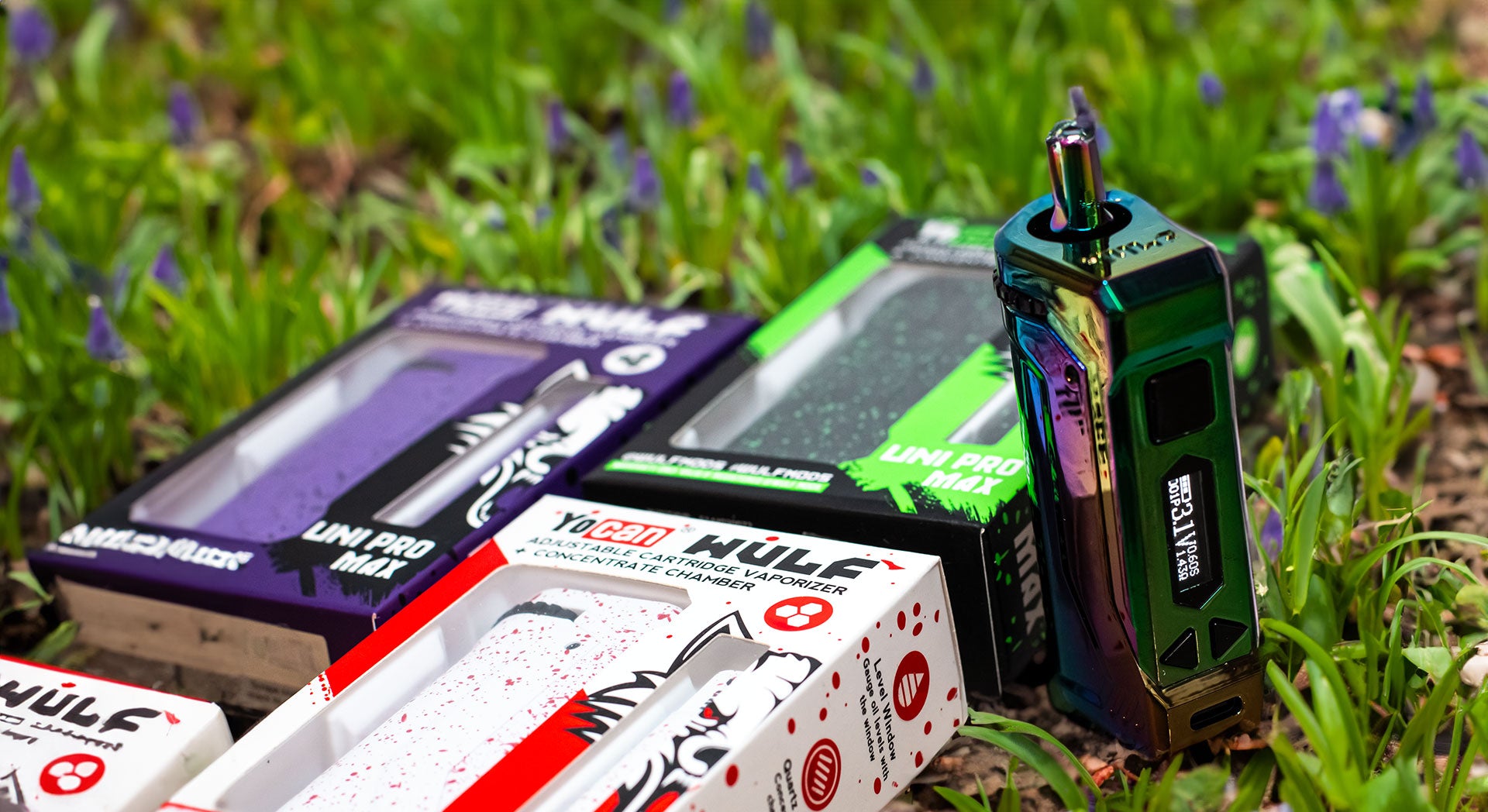 Wulf UNI Pro Max with packaging laying on grass outside with spring flowers