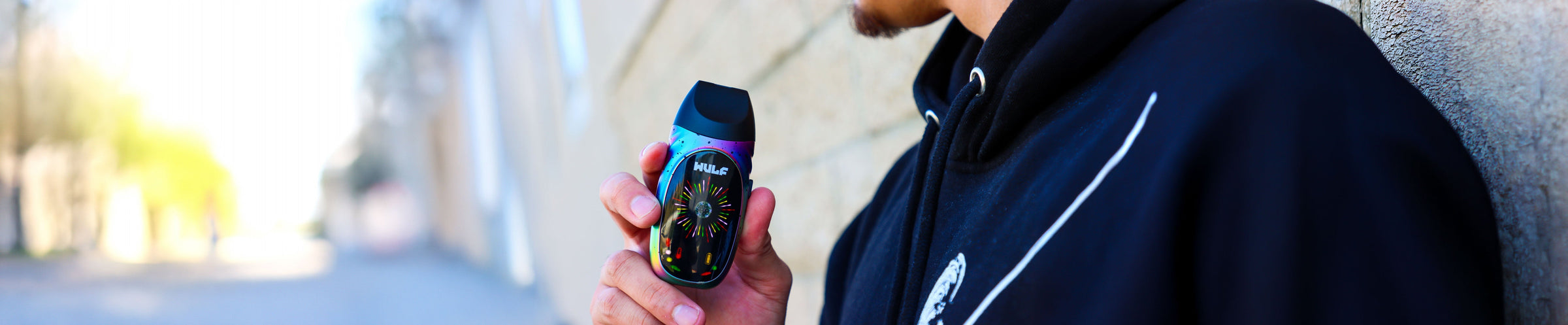 Dry Herb Vaporizers Collection Image with LX Slim in man's hand and colorful smoke nearby
