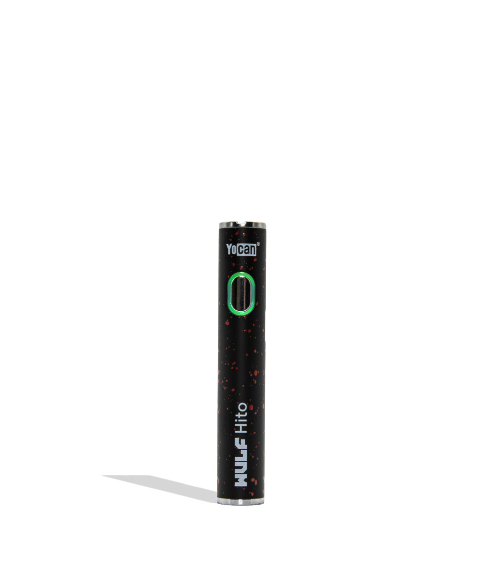 Yocan WULF Mods Hito vape device 510 battery with a glowing green power button, standing upright on a white background with a soft shadow. Black red spatter color.