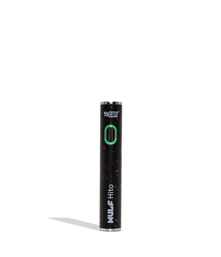 Yocan WULF Mods Hito vape device 510 battery with a glowing green power button, standing upright on a white background with a soft shadow. Black red spatter color.