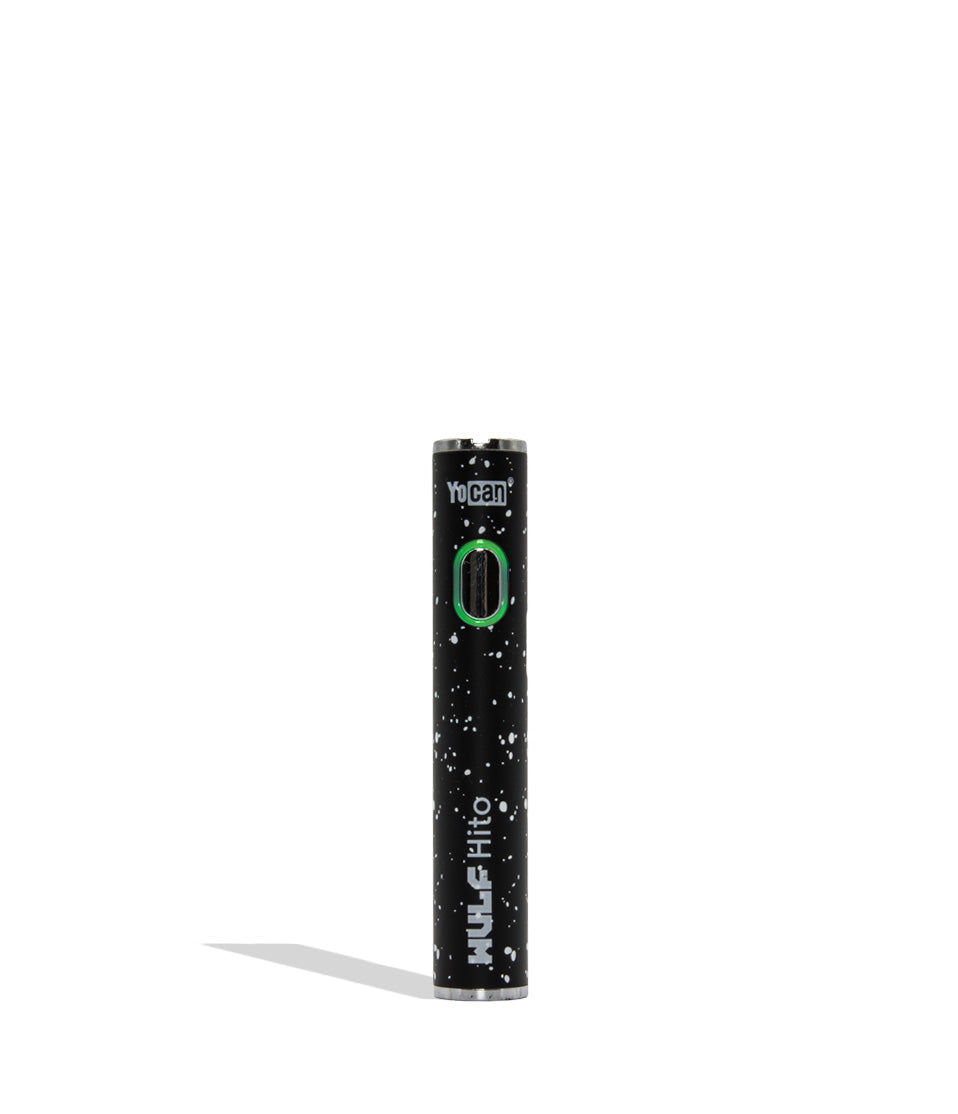 Yocan WULF Mods Hito vape device 510 battery with a glowing green power button, standing upright on a white background with a soft shadow. Black white spatter color.