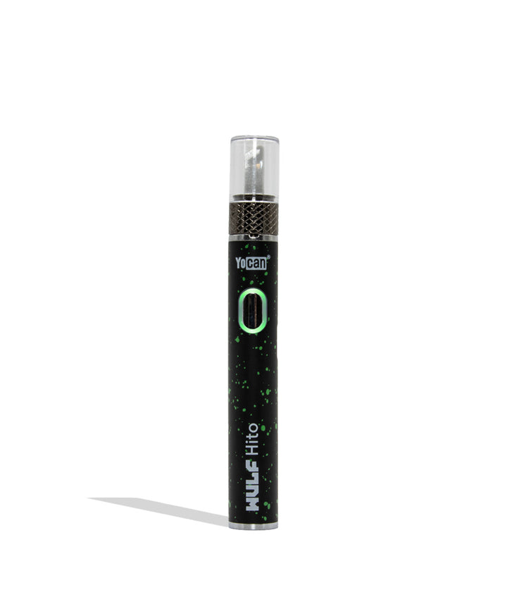 Yocan WULF Mods Hito Knife Kit device 510 battery with a glowing green power button, standing upright on a white background with a soft shadow. black green spatter