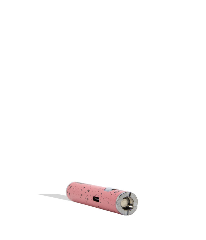 Yocan WULF Mods Hito Knife Kit device 510 battery with a glowing green power button, standing upright on a white background with a soft shadow. pink black spatter laying down horizontally exposing top view