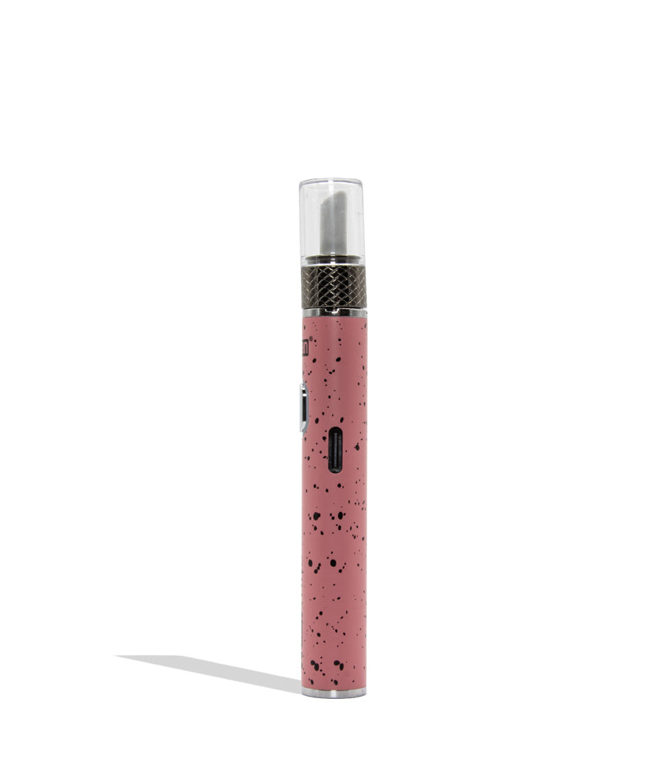 Yocan WULF Mods Hito Knife Kit device 510 battery with a glowing green power button, standing upright on a white background with a soft shadow. USB-C view pink black spatter