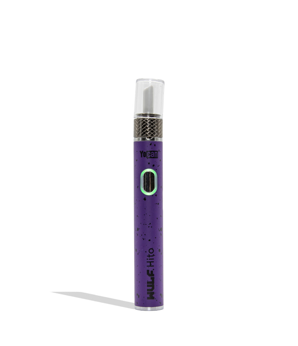 Yocan WULF Mods Hito Knife Kit device 510 battery with a glowing green power button, standing upright on a white background with a soft shadow. Purple blackl spatter