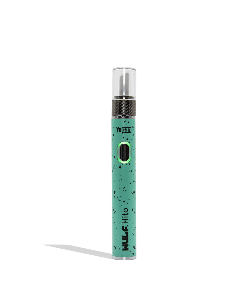 Yocan WULF Mods Hito Knife Kit device 510 battery with a glowing green power button, standing upright on a white background with a soft shadow. Teal black spatter