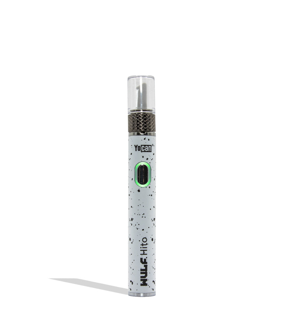 Yocan WULF Mods Hito Knife Kit device 510 battery with a glowing green power button, standing upright on a white background with a soft shadow. WHite black spatter 