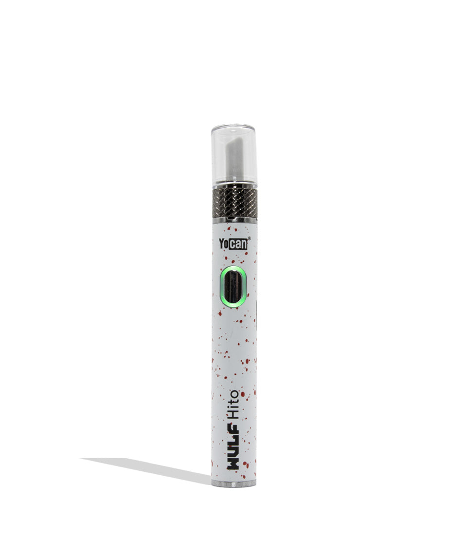 Yocan WULF Mods Hito Knife Kit device 510 battery with a glowing green power button, standing upright on a white background with a soft shadow. White red spatter