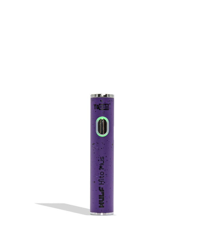 Yocan WULF Mods Hito Plus vape device 510 battery with a glowing green power button, standing upright on a white background with a soft shadow. Puplre black spatter