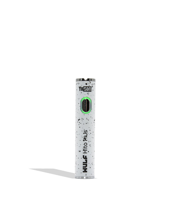 Yocan WULF Mods Hito Plus vape device 510 battery with a glowing green power button, standing upright on a white background with a soft shadow. White black spatter