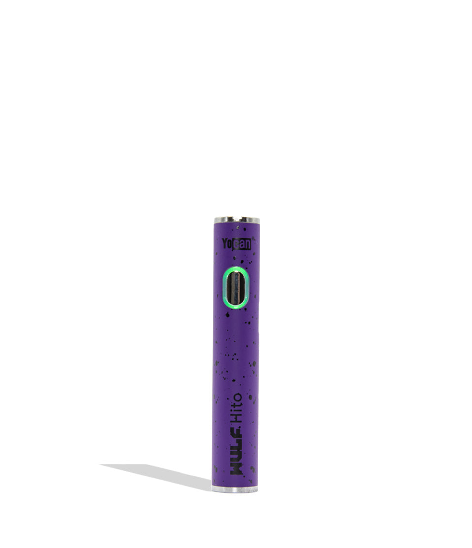 Yocan WULF Mods Hito vape device 510 battery with a glowing green power button, standing upright on a white background with a soft shadow. purple black spatter color.