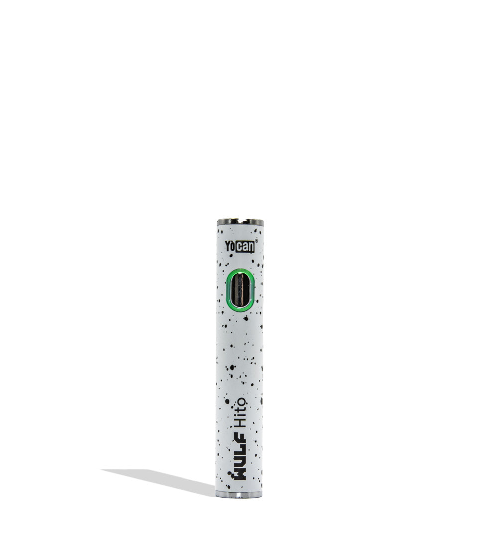 Yocan WULF Mods Hito vape device 510 battery with a glowing green power button, standing upright on a white background with a soft shadow. White black spatter color.