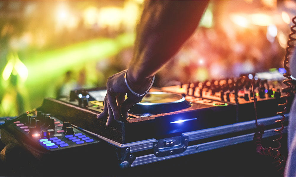 DJ using turn table at festival