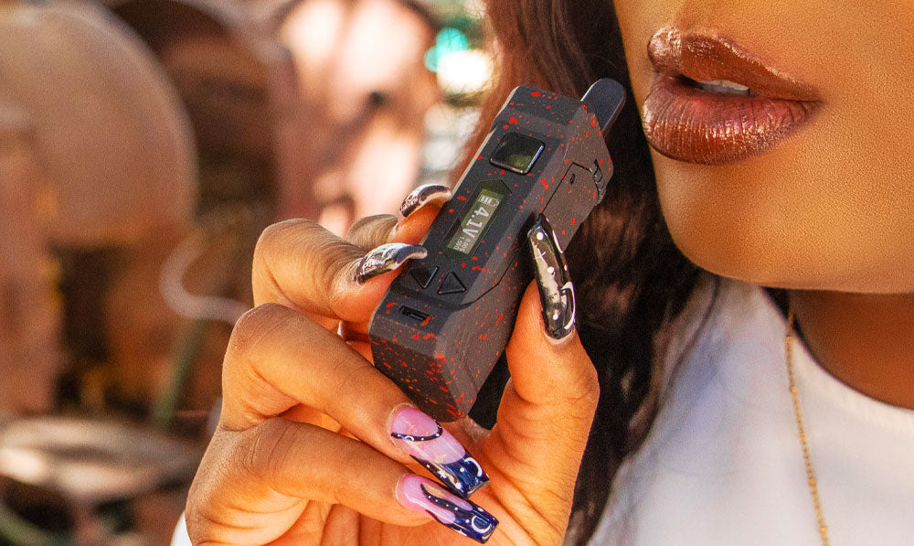 Woman holding Wulf UNI Pro in front of pumpkin patch