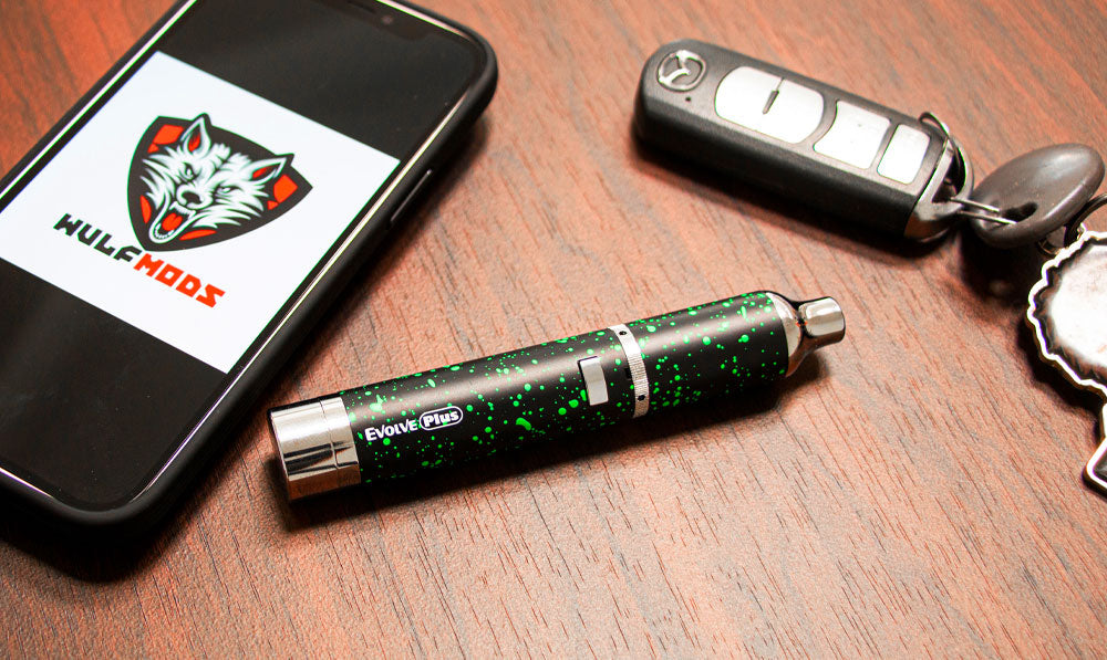 Wulf Evolve resting on wooden desk near open phone and car keys
