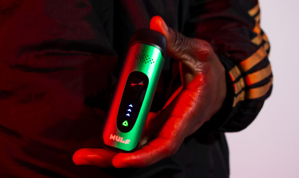 Man holding Wulf Next with red and green lighting