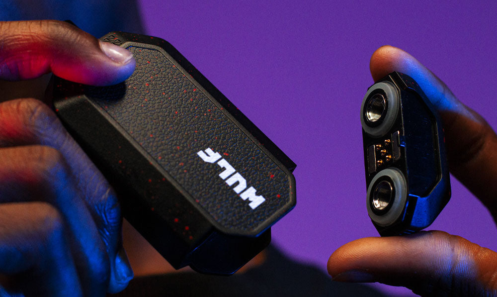 Person holding Wulf Recon 4G apart with focus on cartridge openings
