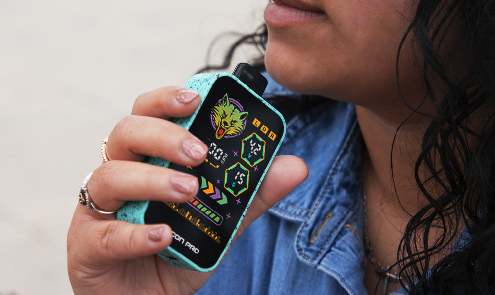 Woman in denim shirt holding Recon Pro near her face