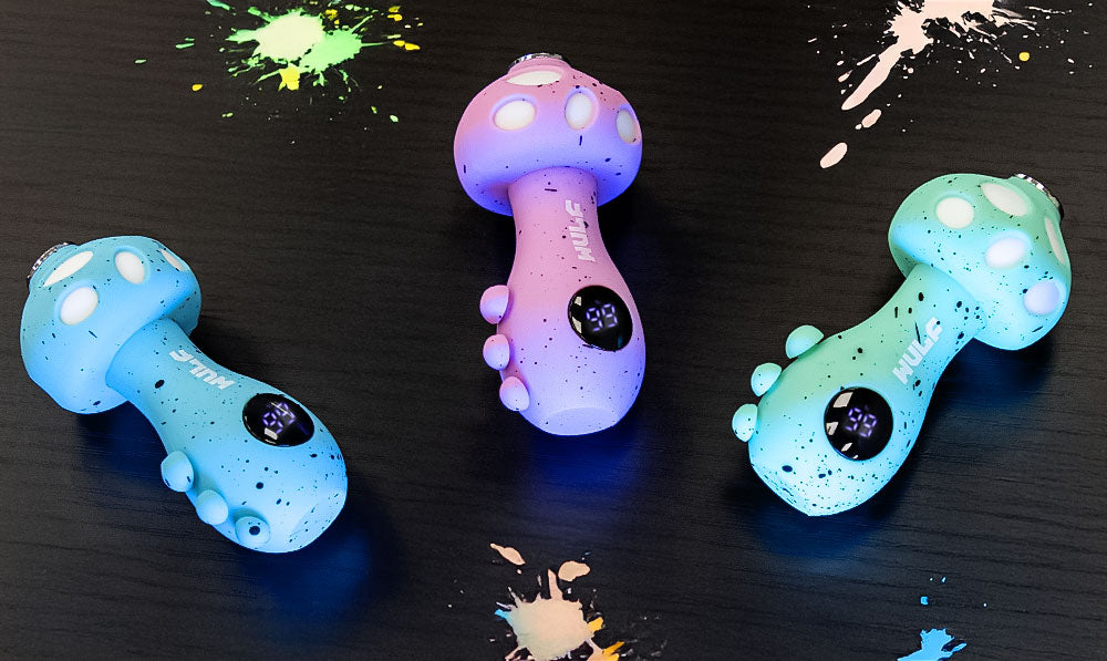 Wulf Tryp units resting on surface of a table with colorful paint splatters nearby