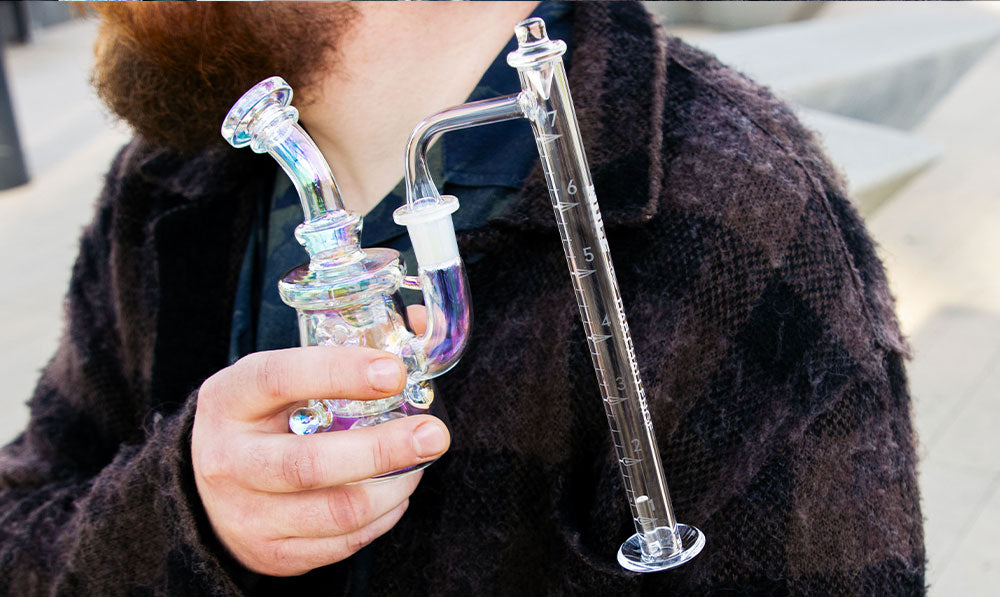 man holding Wulf Dab Rig with Challenge Banger side view