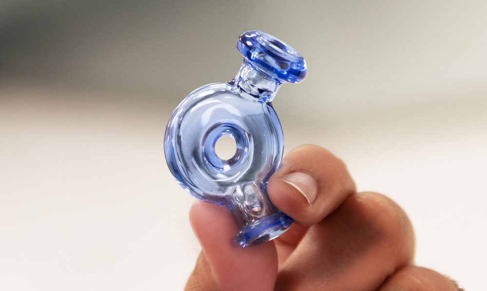 Hand holding Wulf Ring Puffco Pivot Top