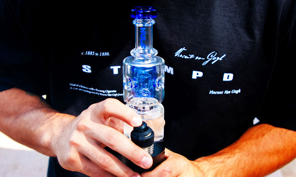 Closeup of man holding Wulf Fuse Puffco Top