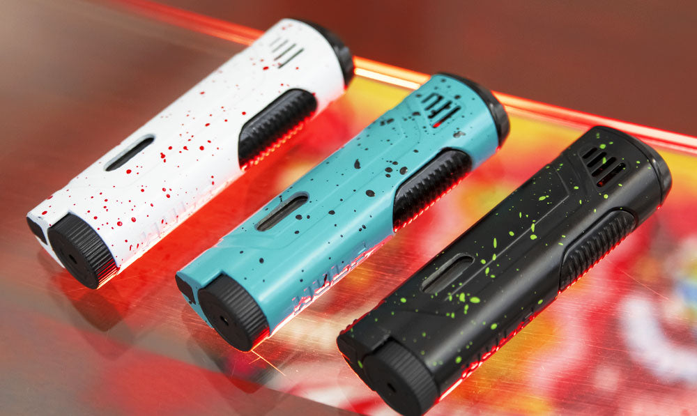 Three Wulf Blitz Torches resting on glass surface over wooden table