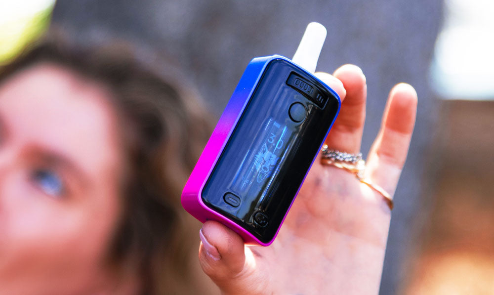 Closeup of woman holding Wulf UNI 3.0 up to the sky
