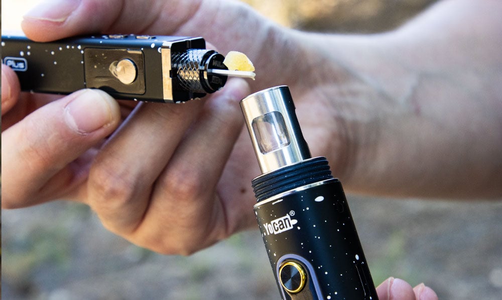 wax being loaded into the WULF Orbit 2.0 concentrate vaporizer