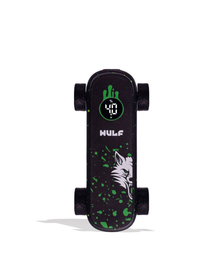A miniature black skateboard with green splatter details, a white wolf graphic, and a digital LED display on the deck, shown on a white background.