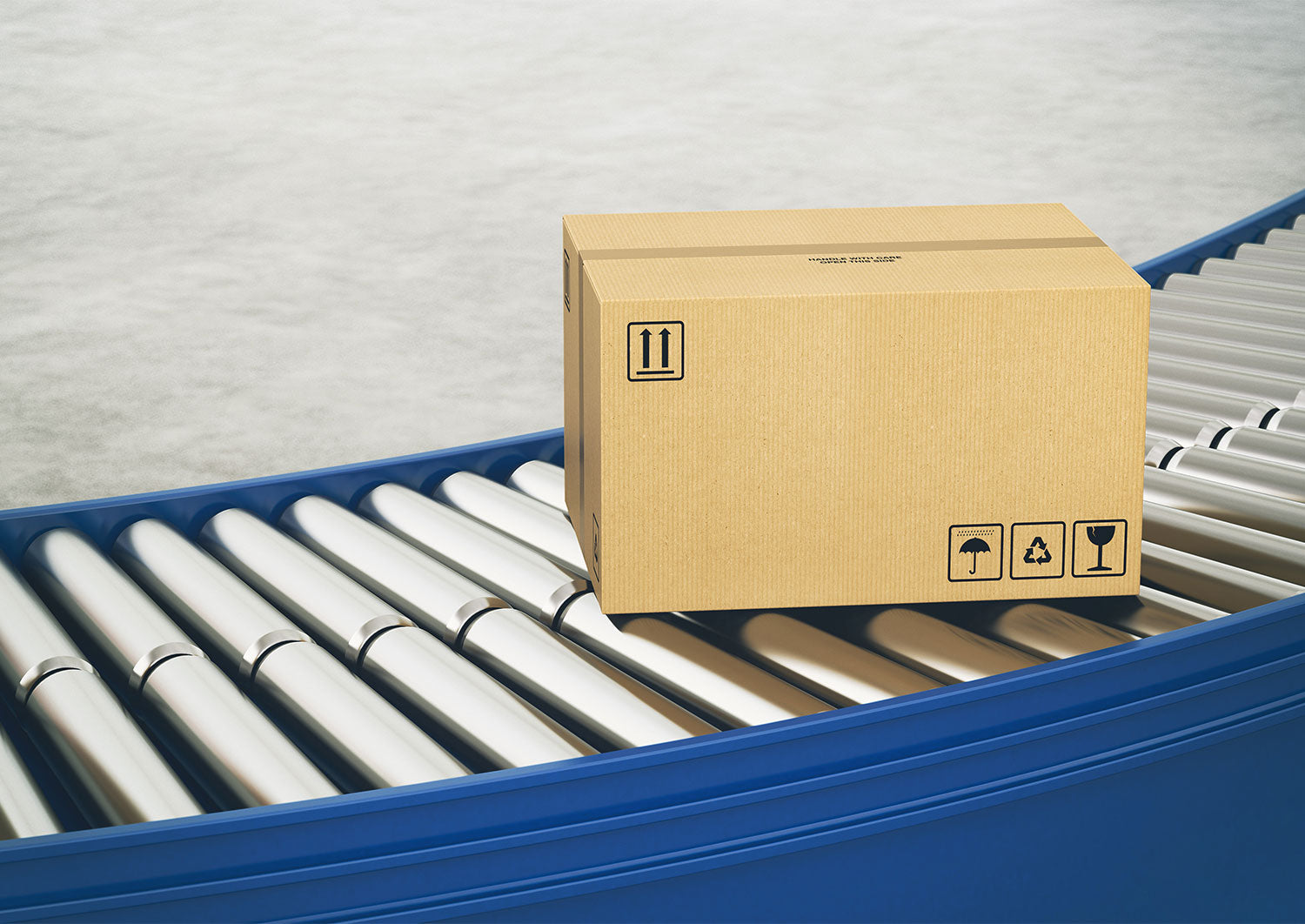 Plain unbranded brown shipping box on a blue roller conveyor