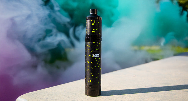 Evolve Plus XL standing on platform with colorful smoke clouds nearby