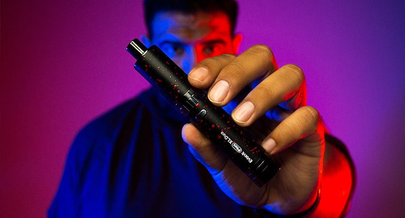 Man holding Wulf Evolve Plus XL Duo in studio