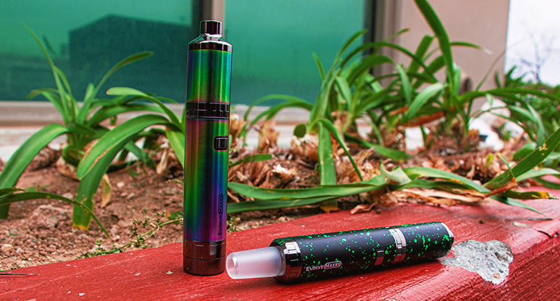 WULF Evolve Maxxx three in one vaporizer on a red table beside plants