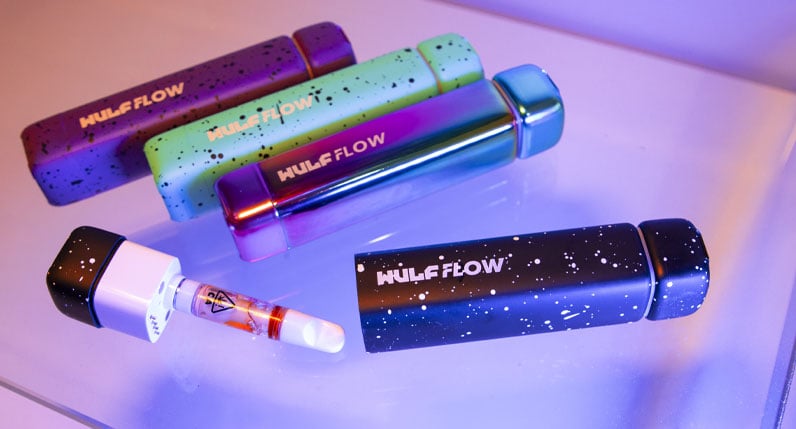 Wulf Flow units resting on glass surface with blue lighting
