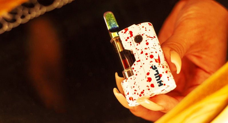 Woman holding Wulf Micro Max under soft warm light