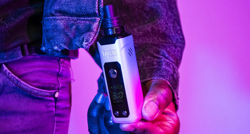 Man holding Wulf Nestor under blue and red studio lighting