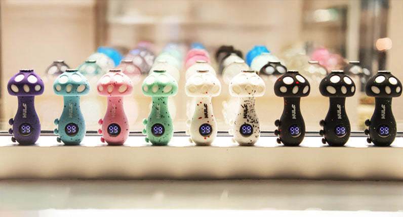 WULF TRYP mushroom shaped vaporizers in several colours on a shelf