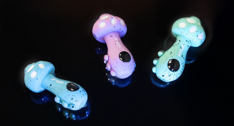 WULF TRYP mushroom shaped vaporizers glowing under dark lighting