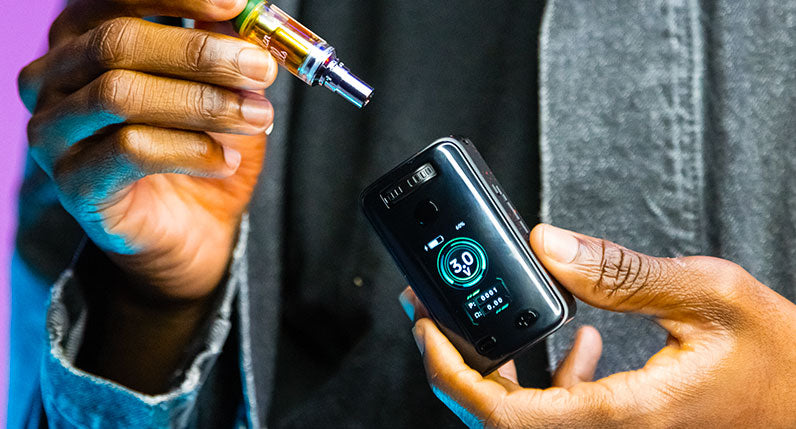 man in jacket holding the Wulf UNI 3.0 with 2g cartridge