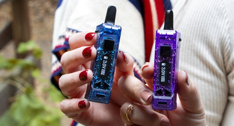 Two women holding Wulf X-Ray UNI Pro in front of park setting