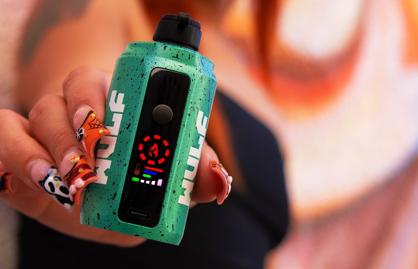 person holding wulf mods device growler portable concentrate e-rig